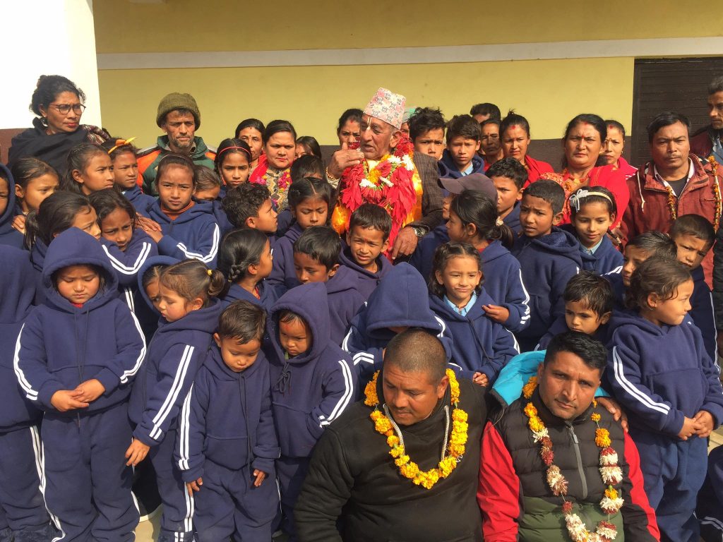 ishwor shilwal distribute warm clothes to students in nuwakot
