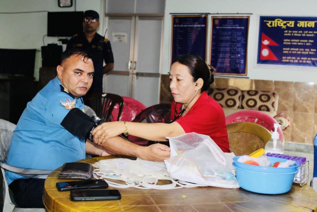 nuwakot police chief ramesh pandit checking him blood pressure in blood donation program