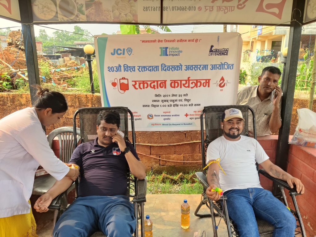 blood donor donating in 20th blood donor day jci nuwakot