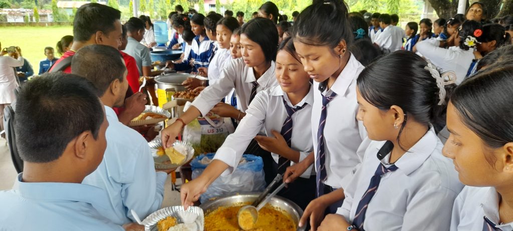 student making a local food dish in Nuwakot