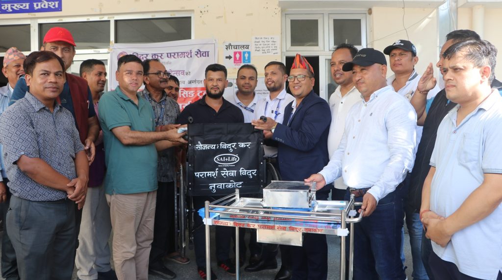 bidur tax handover wheelchair and medicine trolly to trishuli hospital