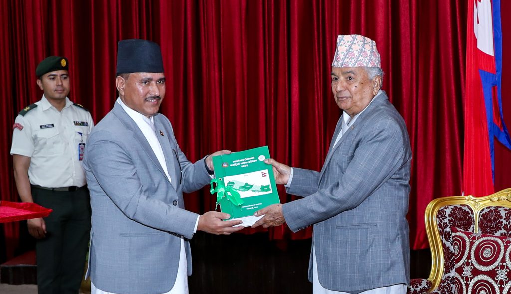 Auditor General Toyam Roy presenting the report to President Ram Chandra Poudel at Sheetal Niwas